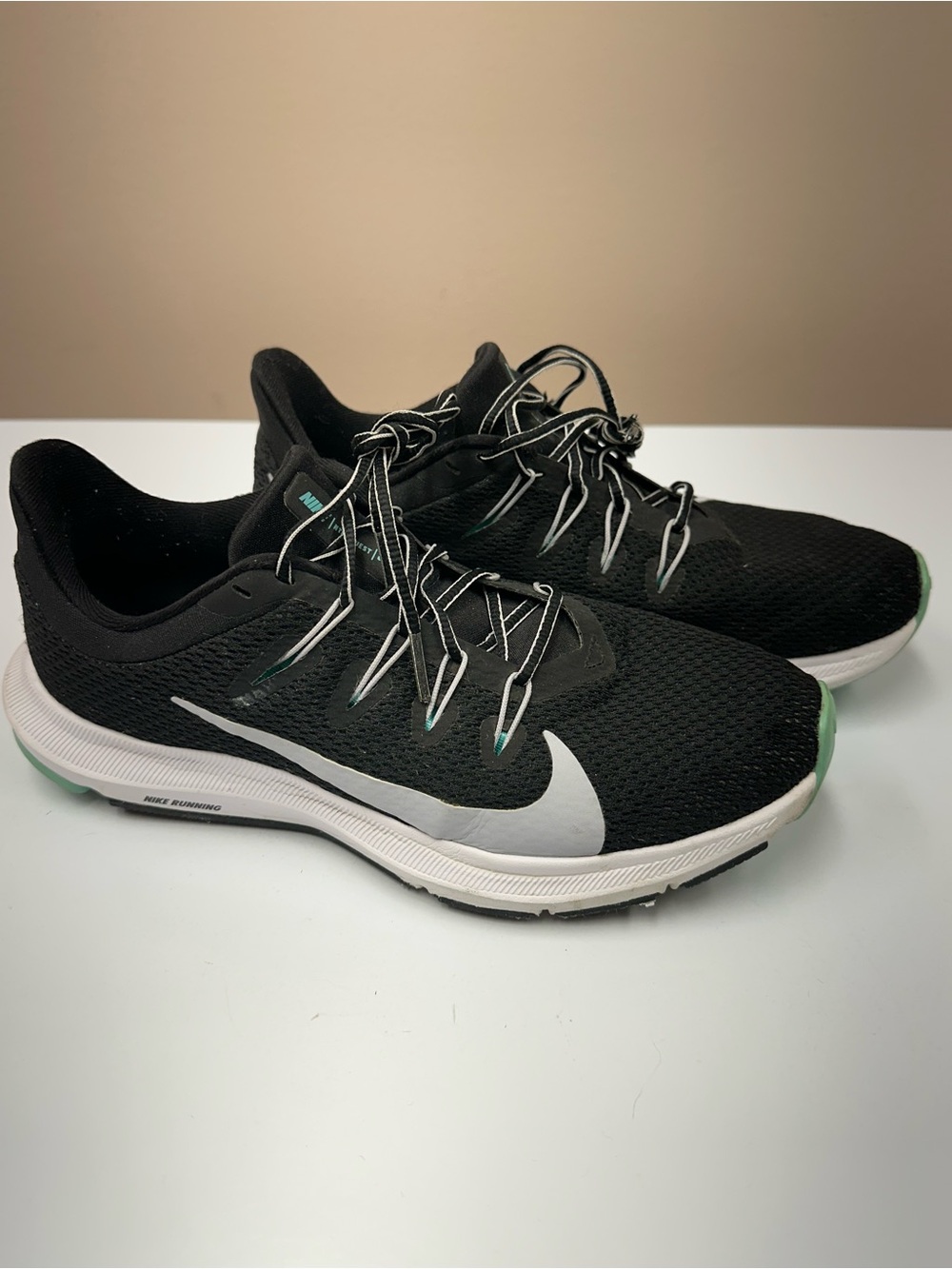 Nike Black Running Sneakers with White Swoosh and Mint Accents